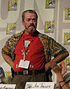 https://upload.wikimedia.org/wikipedia/commons/thumb/6/63/Rodger_Bumpass_-_Standing_at_Panel_-_Cropped.jpg/100px-Rodger_Bumpass_-_Standing_at_Panel_-_Cropped.jpg